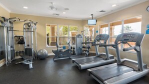 A gym with treadmills, a weight machine, and a rowing machine. - Disney Magic-3 bed 1st floor Windsor Hills condo, just 1.5 miles from WDW! (Four Corners)