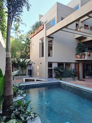 Outdoor pool, open 8:00 AM to 9:30 PM, pool umbrellas, pool loungers