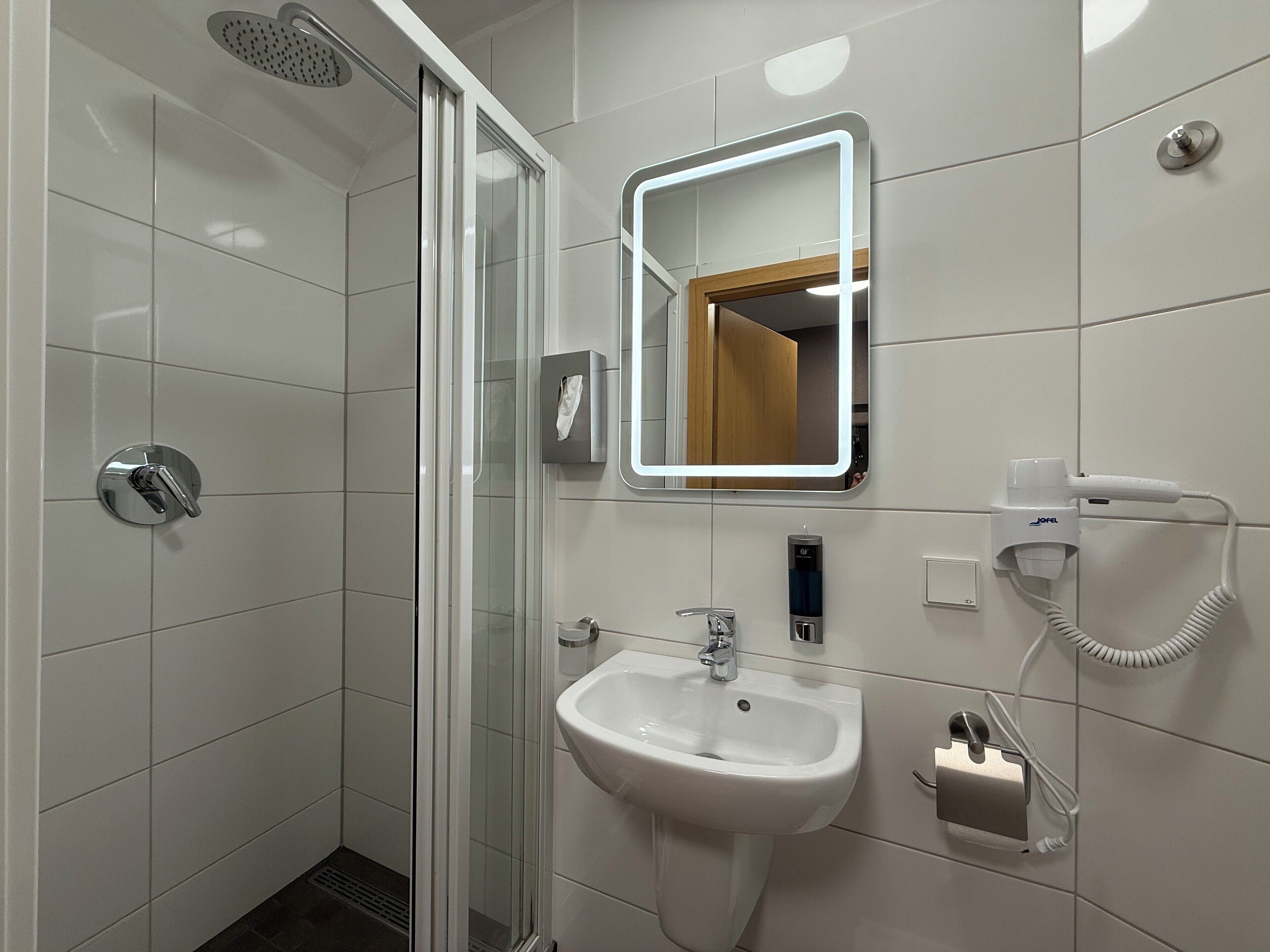 Hair dryer, towels, soap, shampoo