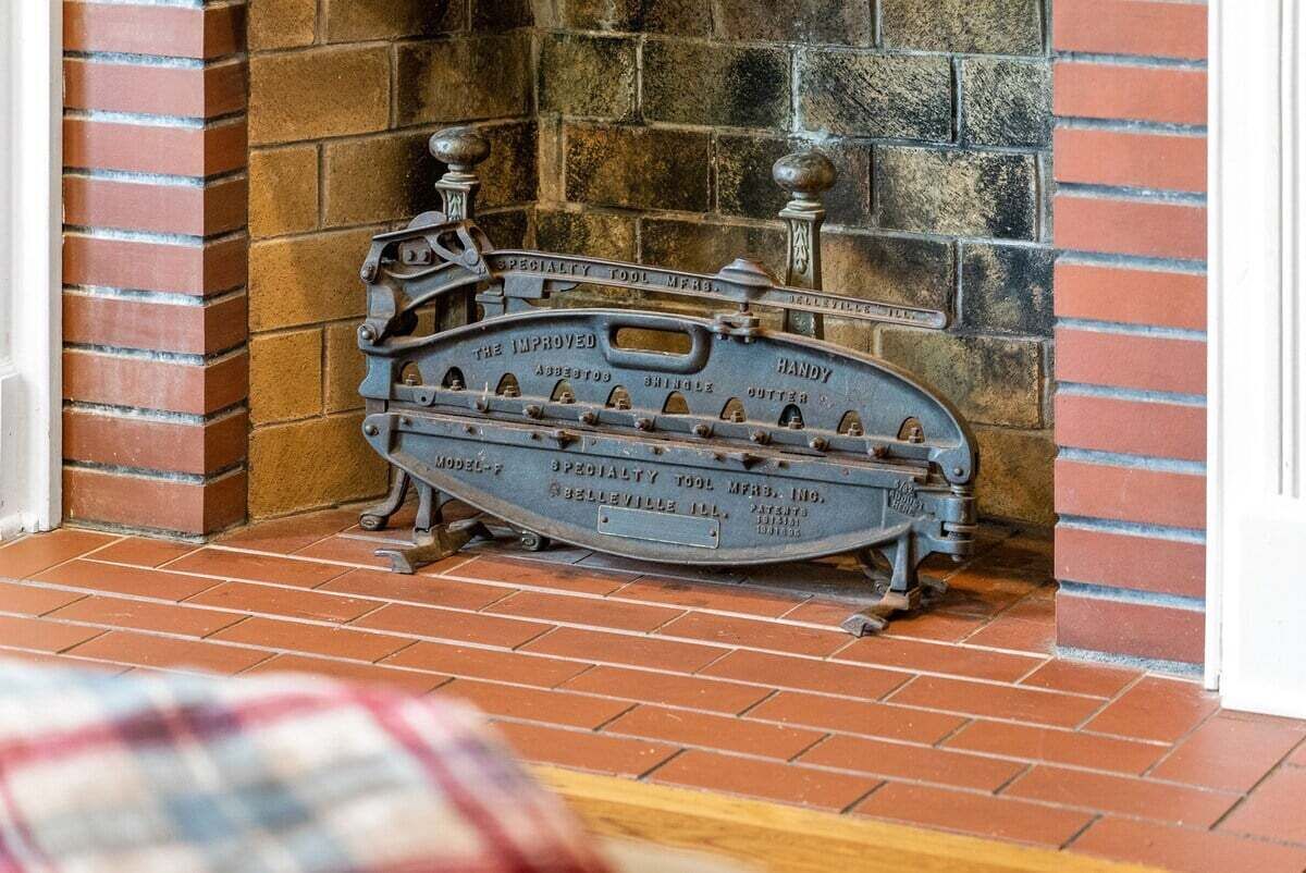 A vintage tool chest against a brick wall.