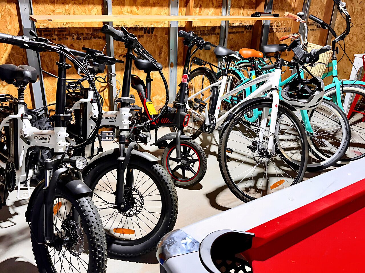 Bicycles parked in a row, possibly in a rental station.