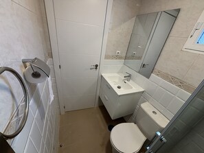 Shower, hair dryer, towels, toilet paper