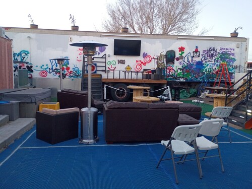 Creative Industrial Retreat with Decks, Games, Hot Tub & Spray Paint Trailer