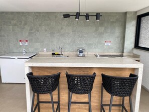 Fridge, microwave, coffee/tea maker, cookware/dishes/utensils