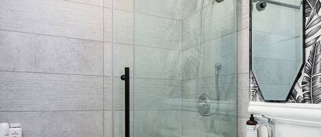 Shower, hair dryer, towels, soap
