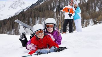 A snowy mountain landscape with a ski slope.