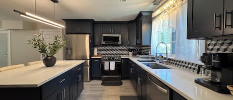 Coffee/tea maker, fridge, microwave, oven