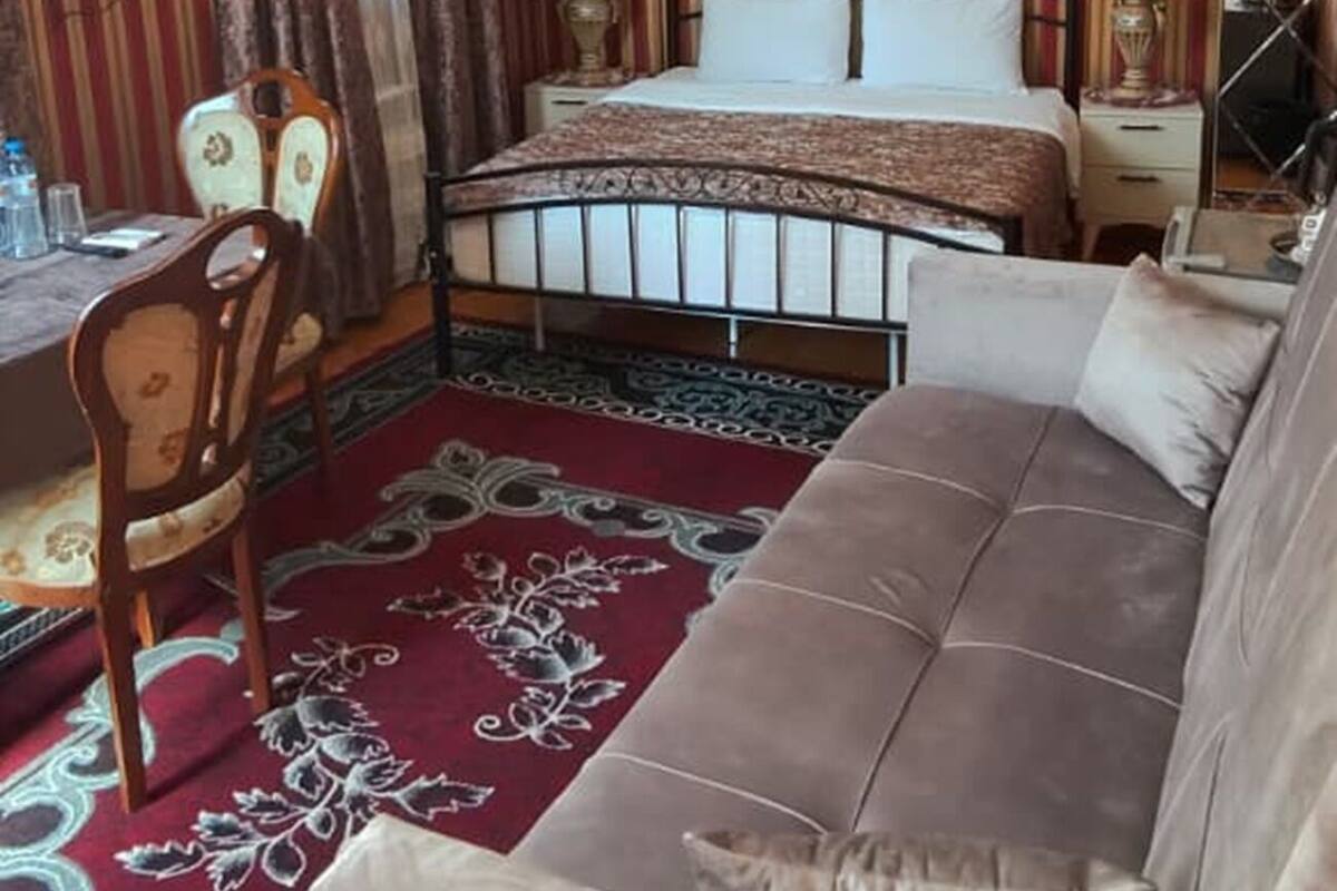 Deluxe Room, City View | Living area | 32-inch Smart TV with satellite channels, books, printers