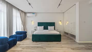 Luxury Apartment, City View | In-room safe, desk, laptop workspace, iron/ironing board