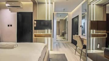 Luxury Apartment, City View | In-room safe, desk, laptop workspace, iron/ironing board