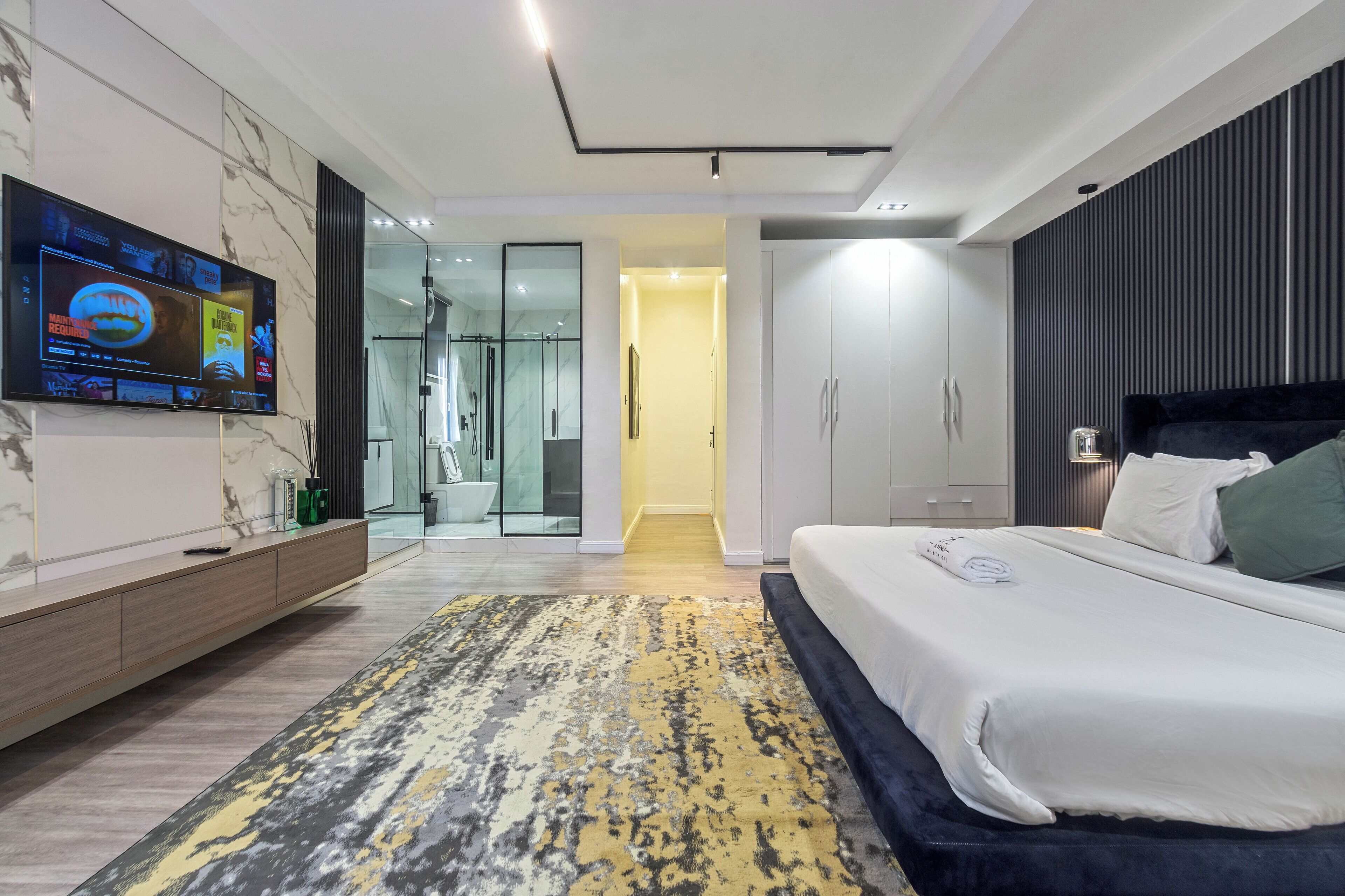 Luxury Apartment, City View | In-room safe, desk, laptop workspace, iron/ironing board