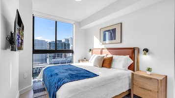 Tabla de planchar con plancha, wifi y ropa de cama