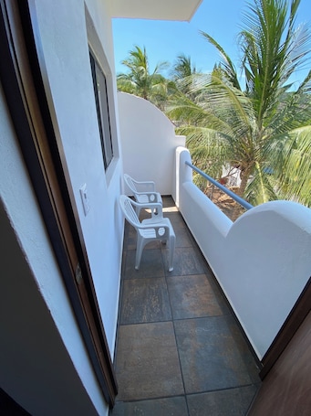Property grounds. Very comfortable suite with 2 dbl beds, terrace and AC. Only 2 blocks from beach