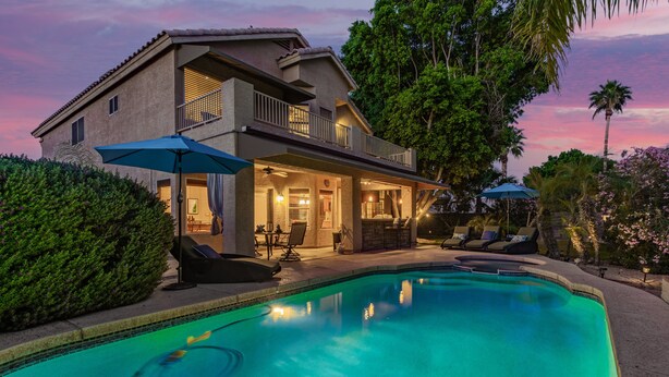 A two-story house with a swimming pool, outdoor furniture, and a balcony. - Family Fun in Ahwatukee Phoenix (Phoenix)