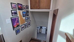 A staircase with wooden steps leading to a lower level. - The Quilting House a charming craftsman home centrally located in Burley (Burley)