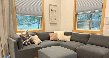 Ember & Evergreen Retreat with covered hot tub and patios in charming Ashford