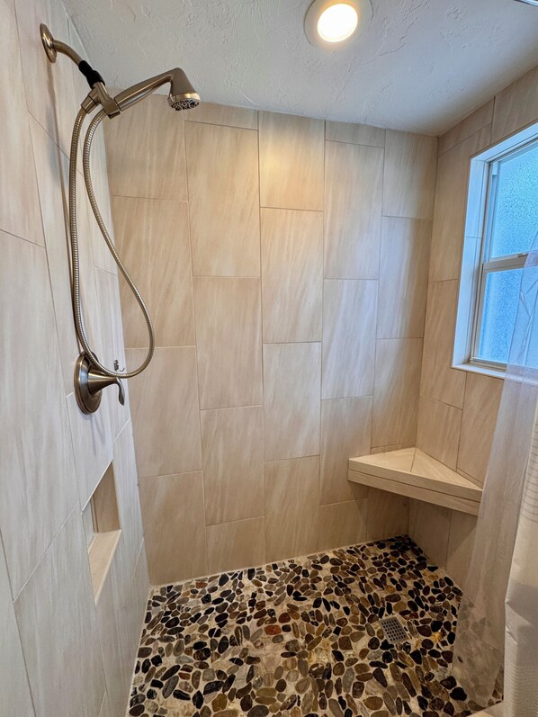 Shower, hair dryer, towels, soap