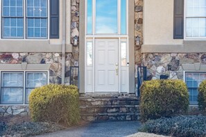 A two-story building with a stone facade, a white front door, and a small step leading to the entrance. - 530 Waterford Drive, Cartersville (Cartersville)