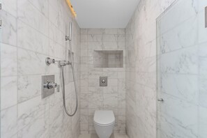 Shower, hair dryer, towels, soap