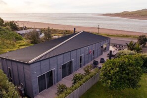 Exterior - Ocean Beach Retreat • Stylish Prime Beachfront (Raglan)