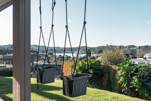 Property grounds - Hillside Haven • Design-led Beach Escape (Raglan)