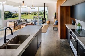 TV, fireplace - Fantails Hideaway • Coastal Escape • Luxurious (Raglan)