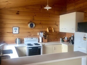 Fridge, microwave, oven, stovetop - Bay View Bach • Dreamy Views w/ Bay Access (Raglan)