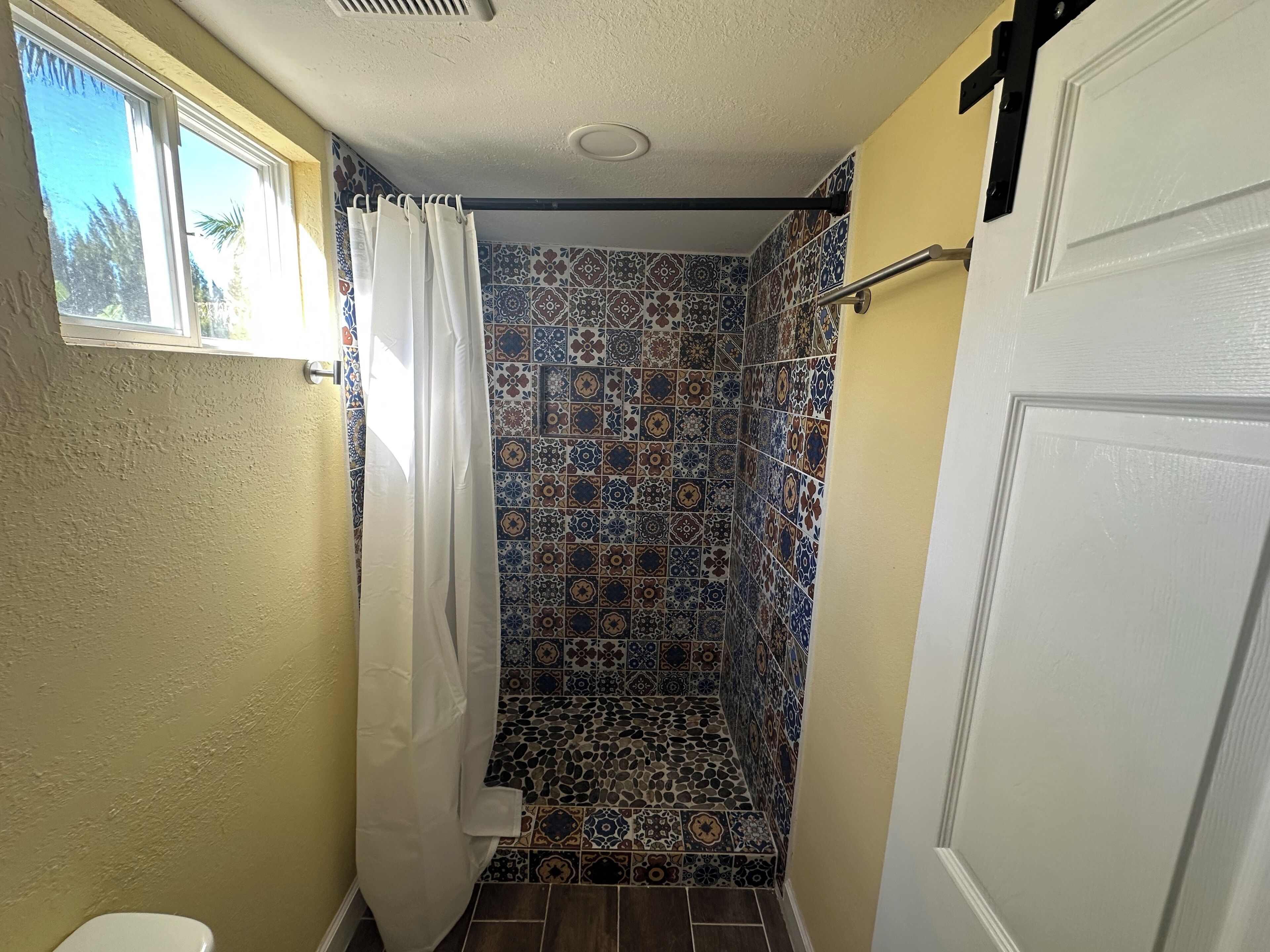 Shower, towels, soap, toilet paper