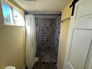 Shower, towels, soap, toilet paper