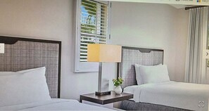 A hotel room with two beds, a nightstand with a lamp, and a window with blinds. - Marriott’s Grande Vista Orlando 1 Bedroom Full Access Resort next t Disney World (Orlando)