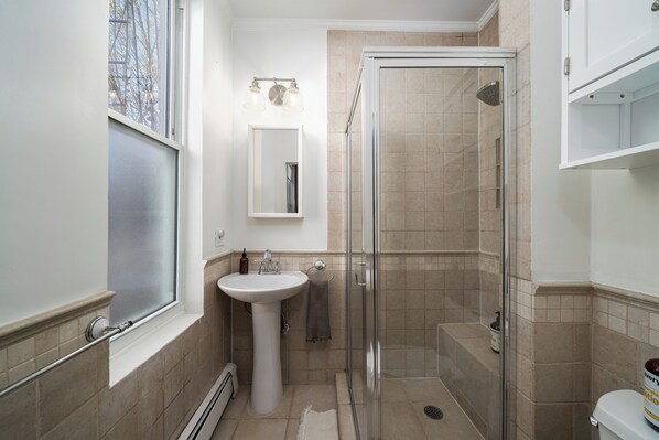 Shower, hair dryer, towels, soap