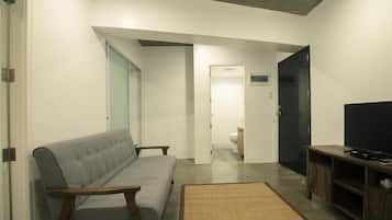 Family Apartment, Multiple Beds, City View | Living area | 32-inch LED TV with cable channels, pay movies