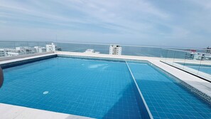 Pool - Beachfront Luxury in Playa Salguero: Modern Condo with Ocean Breeze & Pool (Gaira)