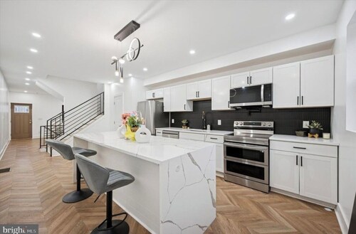 A stunning  5 bedroom 3 bath home offering modern luxury and thoughtful design.