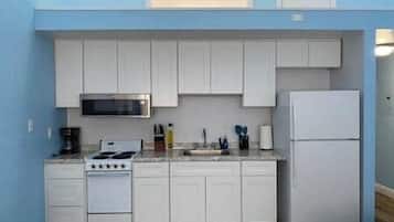 Fridge, microwave, oven, cookware/dishes/utensils