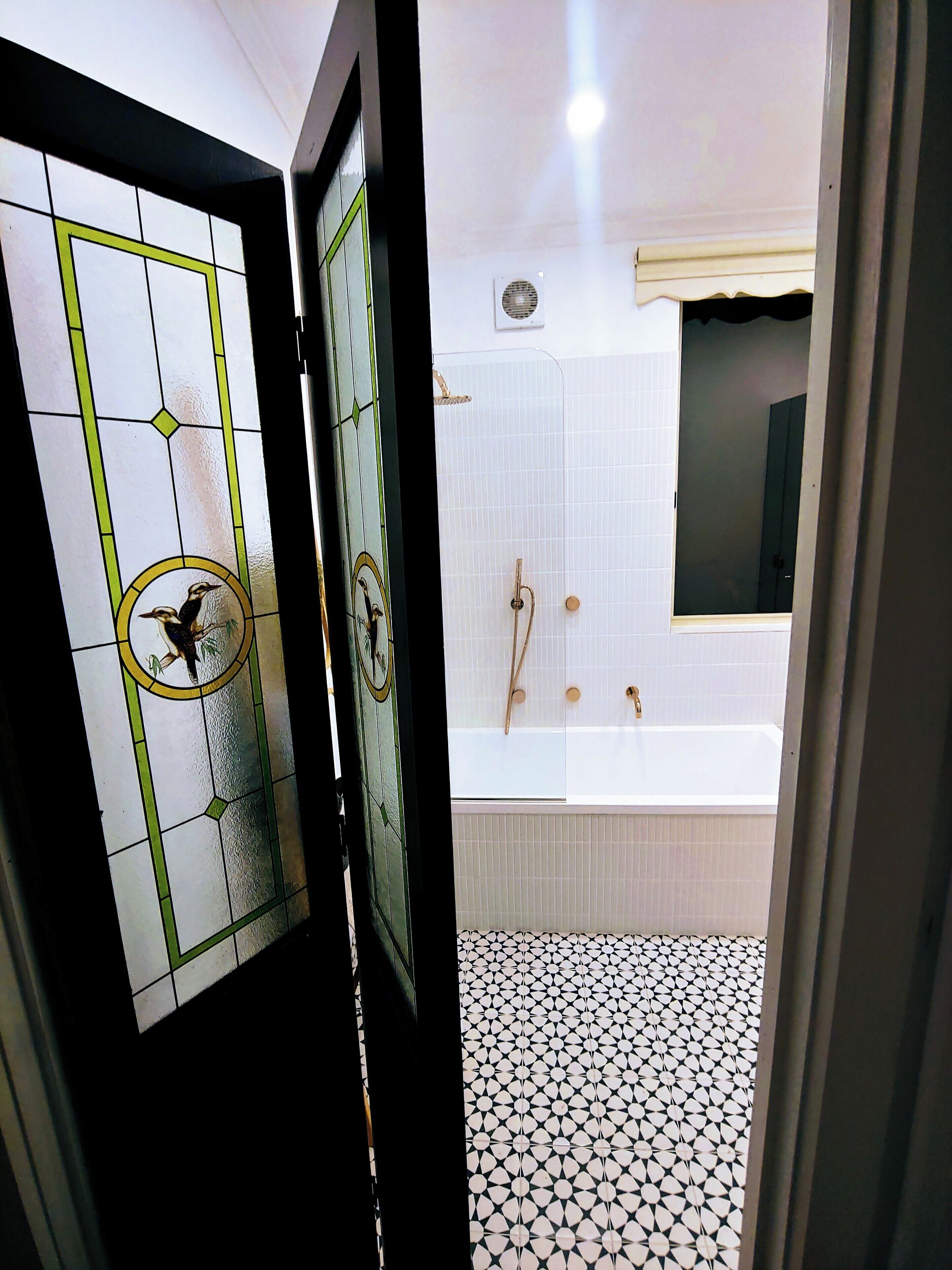 A bathroom with a bathtub, a shower, and a toilet.