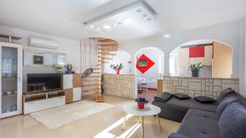 Standard House, Multiple Bedrooms, 2 Bathrooms (Holiday Home Cadjo With Pool) | Living area | 21-inch Smart TV with cable channels