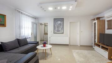 Standard House, Multiple Bedrooms, 2 Bathrooms (Holiday Home Cadjo With Pool) | Living area | 21-inch Smart TV with cable channels