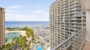 A high-rise hotel with a pool and beach view. - Waikiki Wave Retreat: Ocean Luxe on 17F (Honolulu)