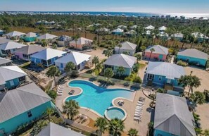 A residential area with houses, a swimming pool, and a view of the ocean. - 5002 Rookery 3 Sea La Vie (Gulf Shores)