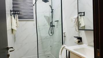 Shower, hair dryer, towels, soap