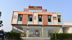 A two-story building with a sign reading "RAJ Palace Hotel & Restaurant." - Hotel Raj Palace & Restaurant (Danta Ramgarh)