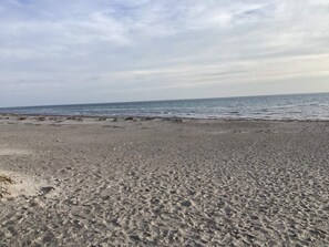 A beach with a wide sandy area and a calm sea. - 4 Star Holiday Home in Vaeggerlose (Vaeggerlose)