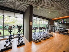 A modern gym with treadmills, elliptical machines, and weight equipment. - Elegant 2BR Luxury Apt•Modern, Cozy, Airport Pool, Mirage , Accra  (Accra)