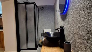 Shower, eco-friendly toiletries, hair dryer, towels