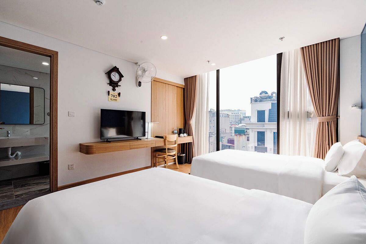 Chambre simple Deluxe | Minibar, coffre-fort, rideaux d’obscurcissement