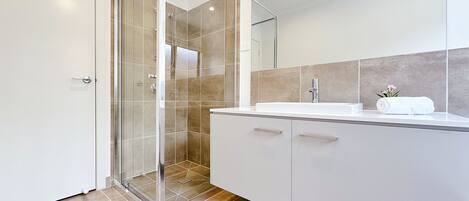 Shower, eco-friendly toiletries, hair dryer, towels