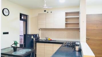 Fridge, stovetop, dining tables