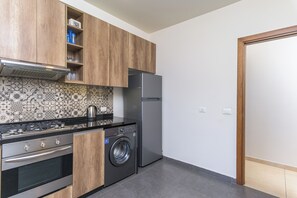 Apartment, 3 Bedrooms, Kitchen, City View | Private kitchen - Alti 3-BR Apt by Santa Maria Jal el Dib (Jal El Dib)