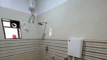 Deluxe Room | Bathroom | Shower, towels, soap, toilet paper